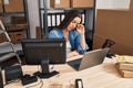 Young beautiful hispanic woman ecommerce business worker stressed using laptop at office Royalty Free Stock Photo