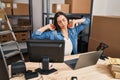 Young beautiful hispanic woman ecommerce business worker stressed using laptop at office Royalty Free Stock Photo