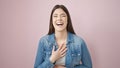 Young beautiful hispanic woman laughing a lot over isolated pink background Royalty Free Stock Photo