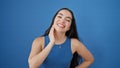 Young beautiful hispanic woman laughing a lot standing over isolated blue background Royalty Free Stock Photo