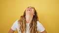 Young beautiful hispanic woman laughing a lot standing over isolated yellow background Royalty Free Stock Photo