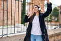 Young beautiful hispanic woman listening to music and dancing at street Royalty Free Stock Photo