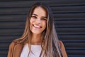 Young beautiful hispanic woman smiling confident standing over isolated black metal background Royalty Free Stock Photo