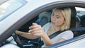 Young beautiful hispanic woman stressed driving car shouting at street Royalty Free Stock Photo