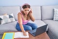 Young beautiful hispanic woman student having online class at home Royalty Free Stock Photo