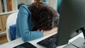 Young beautiful hispanic woman student sleeping on the desk at university classroom Royalty Free Stock Photo