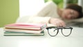 Young beautiful hispanic woman student sleeping on table at home Royalty Free Stock Photo