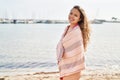 Young beautiful hispanic woman tourist wearing bikini and towel at beach Royalty Free Stock Photo