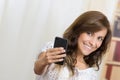 Young beautiful hispanic woman using her cell Royalty Free Stock Photo