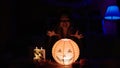 Young beautiful hispanic woman wearing katrina costume doing incantation at home