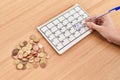 Young beautiful hispanic woman writing on calendar for new home at park Royalty Free Stock Photo