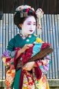 Young beautiful Japanese women called Maiko wear a traditional dress called Kimono at Gion, Kyoto, Japan