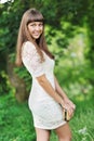 Young beautiful lady in a green park in summer Royalty Free Stock Photo