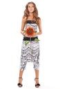 Young beautiful lady in harem pants with sunflower Royalty Free Stock Photo