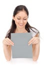 Young beautiful lady holding blank gray card