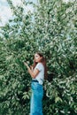 Young beautiful lady surrounded by cherry bird in spring Royalty Free Stock Photo
