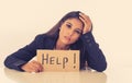 Young beautiful latin business woman overwhelmed and tired holding a help sign. looking Stressed, bored, frustrated, upset and Royalty Free Stock Photo