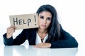 Young beautiful latin business woman overwhelmed and tired holding a help sign. looking Stressed, bored, frustrated, upset and Royalty Free Stock Photo