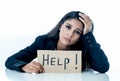 Young beautiful latin business woman overwhelmed and tired holding a help sign. looking Stressed, bored, frustrated, upset and Royalty Free Stock Photo