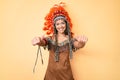 Young beautiful latin girl wearing indian costume approving doing positive gesture with hand, thumbs up smiling and happy for Royalty Free Stock Photo