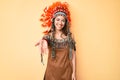 Young beautiful latin girl wearing indian costume smiling cheerful offering palm hand giving assistance and acceptance Royalty Free Stock Photo