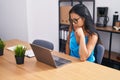 Young beautiful latin woman business worker using laptop with serious expression at office Royalty Free Stock Photo
