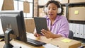 Young beautiful latin woman ecommerce business agent having video call at office Royalty Free Stock Photo