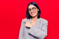 Young beautiful latin woman wearing business clothes smiling cheerful pointing with hand and finger up to the side Royalty Free Stock Photo