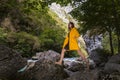 Young beautiful long hair woman stepping by the rocks Royalty Free Stock Photo