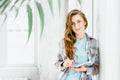 Young beautiful long haired college student girl in casual shirt with notebook, pen. Businesswoman making notes in Royalty Free Stock Photo