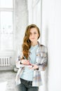 Young beautiful long haired college student girl in casual shirt with notebook, pen. Businesswoman making notes in organizer. Royalty Free Stock Photo