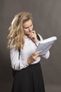 Young beautiful longhaired college girl with papers
