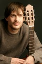 Young beautiful man with guitar.