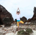 Young beautiful man meditation on beach