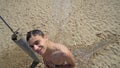 Young beautiful man washing his hair under shower Royalty Free Stock Photo