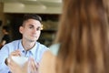 Young beautiful man and woman meet in cafe business Royalty Free Stock Photo