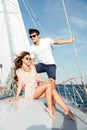 Young beautiful married couple relaxing on the yacht