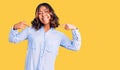 Young beautiful mixed race woman wearing casual business shirt looking confident with smile on face, pointing oneself with fingers Royalty Free Stock Photo