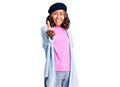 Young beautiful mixed race woman wearing french look with beret smiling friendly offering handshake as greeting and welcoming