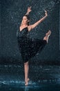 The young beautiful modern dancer dancing under water drops Royalty Free Stock Photo