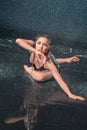 The young beautiful modern dancer dancing under water drops Royalty Free Stock Photo