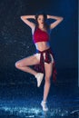 The young beautiful modern dancer dancing under water drops Royalty Free Stock Photo