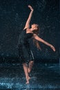 The young beautiful modern dancer dancing under water drops Royalty Free Stock Photo