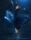 The young beautiful modern dancer dancing under water drops Royalty Free Stock Photo