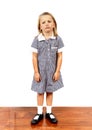 Young beautiful and moody schoolgirl in uniform looking tired bored and upset in frustrated face expression isolated on white back