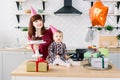 Young beautiful mother and her little daughter are celebrating a birthday. cake with candles. happy birthday baby Royalty Free Stock Photo