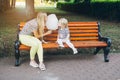 Mother and little daughter eating cotton candy Royalty Free Stock Photo