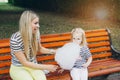 Mother and little daughter eating cotton candy Royalty Free Stock Photo