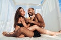 Young beautiful multiracial couple having fun at the beach