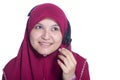 Young beautiful Muslim woman customer service agent with headset on white background Royalty Free Stock Photo